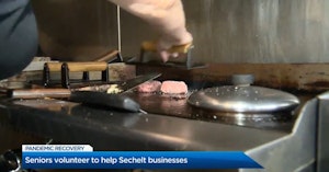 News report showing a grill at a burger restaurant