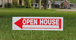 Open house sign on a lawn