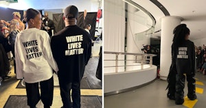 Kanye West and Candace Owens photographed from behind standing together with shirts that say "White Lives Matter" on the back